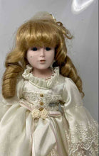 Load image into Gallery viewer, Blonde Curly Hair Blue Eyes Collectible Porcelain Doll In Off-White Maxi Dress