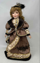 Load image into Gallery viewer, Curly Blonde Hair Brown Eyes Feather Hat Porcelain Doll Collectible With Outfit