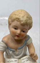 Load image into Gallery viewer, Vintage Bisque Porcelain Collectible Piano Baby Reading A Book Figurine