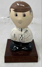 Load image into Gallery viewer, Rock Heads 1999 Ceramic Eye Doctor Eye Chart Signed Figurine On Wood Base
