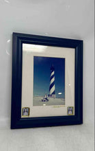 Load image into Gallery viewer, The Image Framed In Blue Features A Print Of The Cape Hatteras Lighthouse