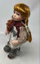 Load image into Gallery viewer, Duck House Heirloom Kassidy Girl Porcelain Doll Holding Brown Teddy Bear