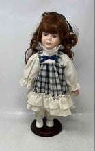 Load image into Gallery viewer, Vintage Geppeddo Collectible Porcelain Doll In Stand With Plaid Dress Outfit
