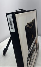 Load image into Gallery viewer, Chanel Bag Resting On Stack Of Fashion Books Iced Coffee Framed Canvas Art Print
