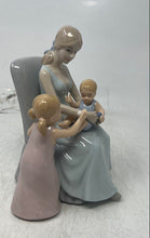 Load image into Gallery viewer, Vintage Porcelain Mother Sitting On A Chair With Her Two Young Children Figurine
