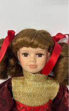 Load image into Gallery viewer, Collectors Choice Brown Hair Collectible Porcelain Doll In Red &amp; Gold Outfit
