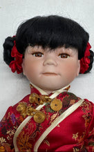 Load image into Gallery viewer, Black Hair Brown Eyes Porcelain Doll Collectible With Traditional Outfit
