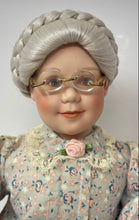 Load image into Gallery viewer, 1991 Sitting Grandmother Decorative Porcelain Doll With Stool And Floral Outfit
