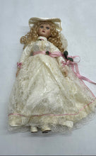 Load image into Gallery viewer, White Lace Dress Pink Ribbon Hat Curly Blonde Hair Collectible Porcelain Doll
