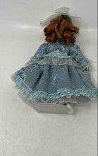 Load image into Gallery viewer, Vintage Collectible Brown Curly Hair Blue Eyes Porcelain Doll In Dress w/ Stand
