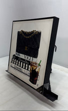 Load image into Gallery viewer, Chanel Bag Resting On Stack Of Fashion Books Iced Coffee Framed Canvas Art Print

