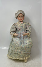 Load image into Gallery viewer, 1991 Sitting Grandmother Decorative Porcelain Doll With Stool And Floral Outfit
