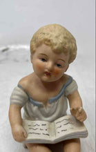 Load image into Gallery viewer, Vintage Bisque Porcelain Collectible Piano Baby Reading A Book Figurine
