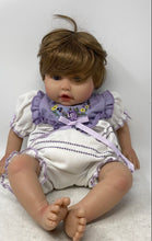 Load image into Gallery viewer, Paradise Galleries Brown Hair Blue Eyes Floral Outfit Sitting Reborn Baby Doll

