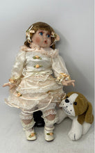 Load image into Gallery viewer, Blonde Hair Blue Eyes Porcelain Doll With Puppy Nipping At Dress Skirt
