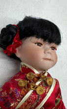 Load image into Gallery viewer, Black Hair Brown Eyes Porcelain Doll Collectible With Traditional Outfit
