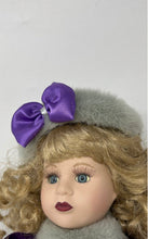 Load image into Gallery viewer, Blonde Curly Hair Blue Eyes Collectible Porcelain Doll With Purple Outfit
