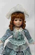 Load image into Gallery viewer, Vintage Collectible Brown Curly Hair Blue Eyes Porcelain Doll In Dress w/ Stand
