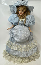 Load image into Gallery viewer, Blue Victorian Dress Blonde Curly Hair Lace Hat Light Complexion Porcelain Doll
