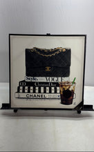Load image into Gallery viewer, Chanel Bag Resting On Stack Of Fashion Books Iced Coffee Framed Canvas Art Print
