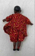 Load image into Gallery viewer, Vintage Hard Plastic Play Doll Featuring A Red Yellow Dress With Floral Pattern

