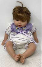 Load image into Gallery viewer, Paradise Galleries Brown Hair Blue Eyes Floral Outfit Sitting Reborn Baby Doll
