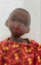 Load image into Gallery viewer, Vintage Hard Plastic Play Doll Featuring A Red Yellow Dress With Floral Pattern
