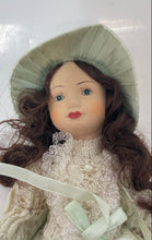 Load image into Gallery viewer, Vintage Brown Hair Collectible Mini Bisque Porcelain Doll With Green Outfit
