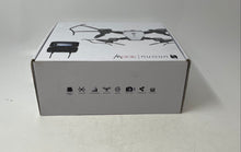 Load image into Gallery viewer, Unonu 300w Silver Black Drone Quadcopter With Remote Controller Not Tested
