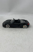 Load image into Gallery viewer, Jada Toys Porsche Carrera GT Black Collectible Open Doors Diecast Car Toy
