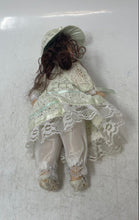 Load image into Gallery viewer, Vintage Brown Hair Collectible Mini Bisque Porcelain Doll With Green Outfit
