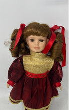Load image into Gallery viewer, Collectors Choice Brown Hair Collectible Porcelain Doll In Red &amp; Gold Outfit
