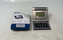 Load image into Gallery viewer, Curtoons World Time Travel Calendar Alarm Folding Device Calculator Untested
