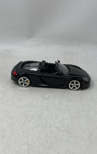 Load image into Gallery viewer, Jada Toys Porsche Carrera GT Black Collectible Open Doors Diecast Car Toy
