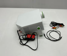 Load image into Gallery viewer, MerchSource The Black Series By Shift Portable Entertainment Projector Powers On
