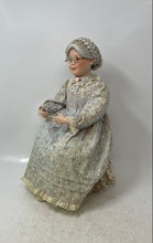 Load image into Gallery viewer, 1991 Sitting Grandmother Decorative Porcelain Doll With Stool And Floral Outfit

