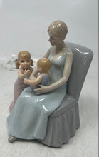 Load image into Gallery viewer, Vintage Porcelain Mother Sitting On A Chair With Her Two Young Children Figurine
