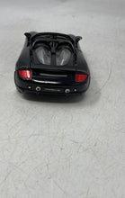 Load image into Gallery viewer, Jada Toys Porsche Carrera GT Black Collectible Open Doors Diecast Car Toy
