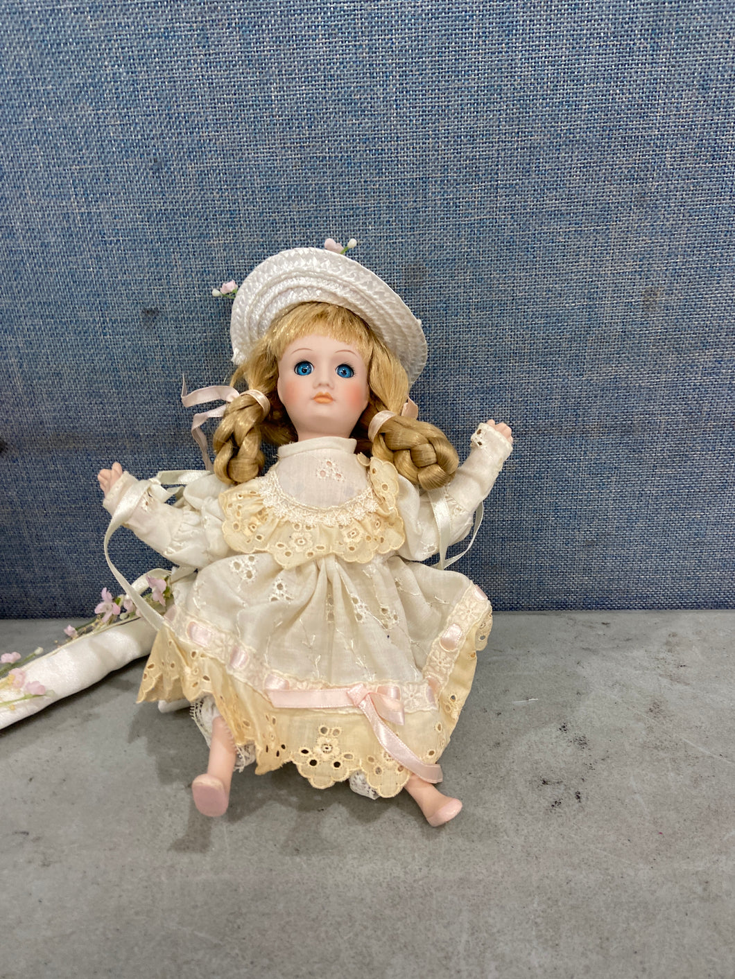 Ceramic Doll Brown Hair Blue Eyes Dressed Up With Hat